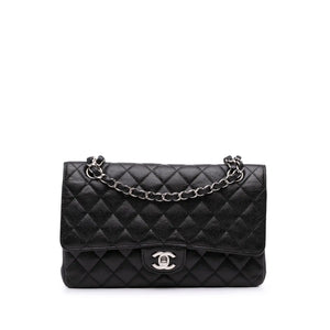<h1>L'élégance intemporelle : le 2.55 Revolution de Chanel en noir Kaviar</h1>