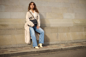 stylish lady holding onto her secondhandbags chanel bag