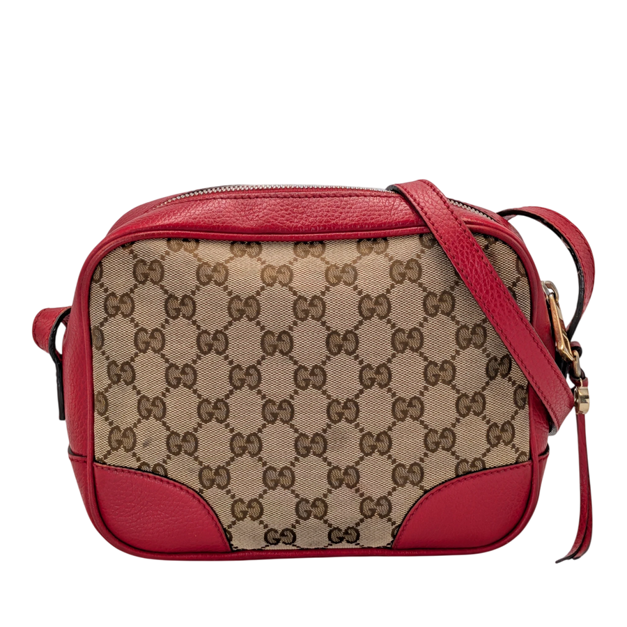 Secondhandbags AG Gucci Bree Disco crossbody bag in beige GG canvas with red leather trim and strap. Features zip closure and tassel detail.