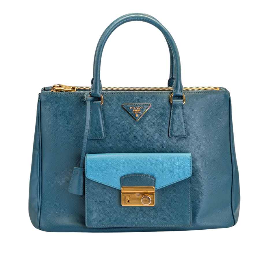 Secondhandbags AG Prada Saffiano Lux blue leather tote bag with front pocket, gold hardware, and structured design.